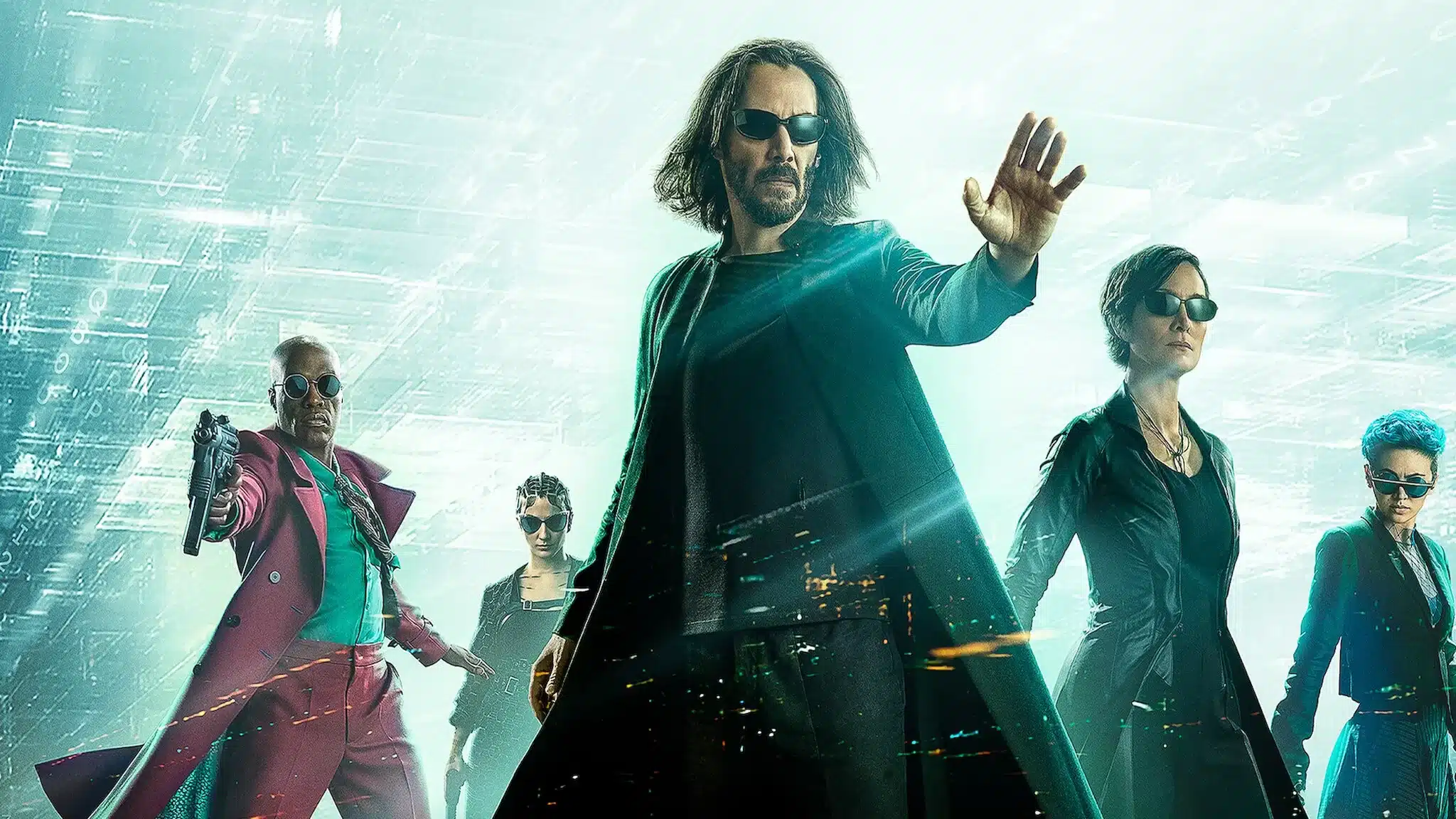 Neo, Trinity y el nuevo equipo de Matrix Resurrections posando con actitud desafiante sobre un fondo digital verde, mostrando el estilo futurista y visual característico de la película.